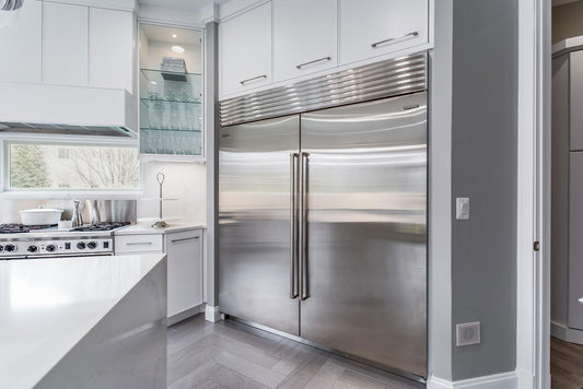 Stainless steel refrigerator with a shiny, protective ceramic coating applied by Fixture Shield